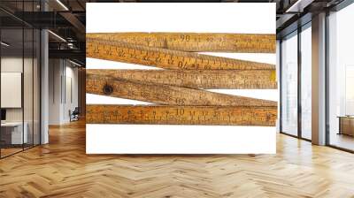 Old wooden folding meter ruler measuring centimeters on the white surface Wall mural