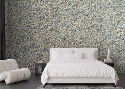 Small colored stone gravel covered surface fragment as abstract background texture. Wall mural