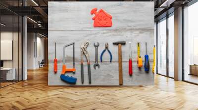 Set of work tool on gray wooden background with icon of house in space, industry engineer tool concept.still-life. Wall mural