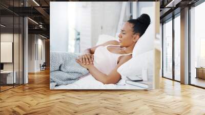 Woman in bed, stomach pain and menstruation cramps with endometriosis, health problem and sick. Female person with digestion issue, abdominal ache and period with gastrointestinal emergency at home Wall mural