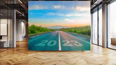 road 2023. the road leads to the mountains in the fog at sunrise. Wall mural