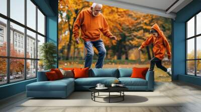 Grandfather and Grandson Playing Soccer in Autumn Park
 Wall mural