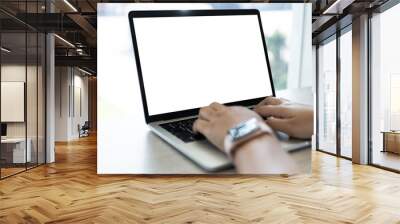 Mockup of a businessman using laptop computer white screen mockup template with clipping path. Wall mural