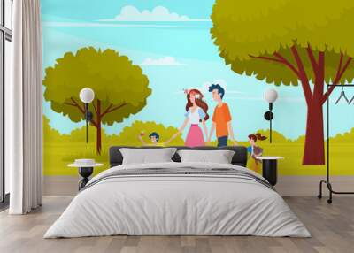 Happy family walk in park or city garden. Mom, dad and two children spend time outdoors on background of tall trees. Fun days, parents hold children by hands walking along green alley. Family holiday Wall mural