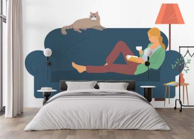 Woman character reading literature, side view of female character holding cup and book. Person lying with cat on sofa, bedside table and lamp, room. Vector illustration in flat cartoon style Wall mural