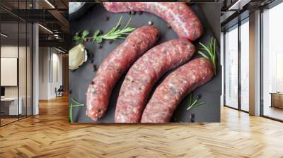 Raw Sausages with Herbs and Spices on Slate Wall mural