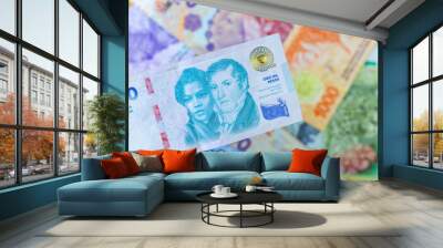 Argentina money. New 10,000 pesos banknote against the background of other Argentine pesos. Financial business concept, close up Wall mural