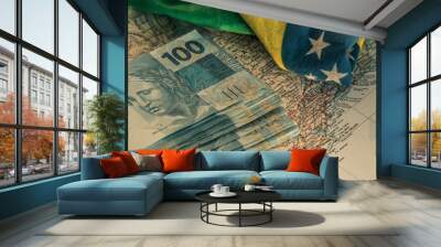 Brazilian money, 100 reais banknotes on the map of Brazil with a fragment of the national flag Wall mural