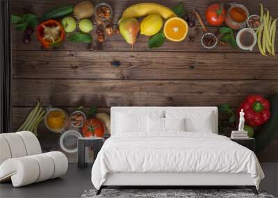 Healthy food, clean food selection:  fruits, vegetables, seeds, spices on brown boards with free space in the middle Wall mural