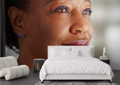 A close-up of an older black woman being very happy Wall mural