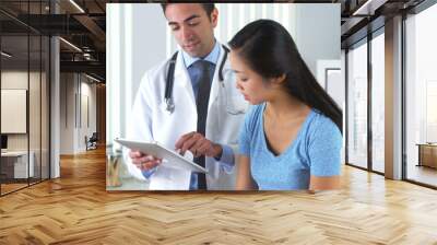 Asian patient talking with her doctor about her test results Wall mural