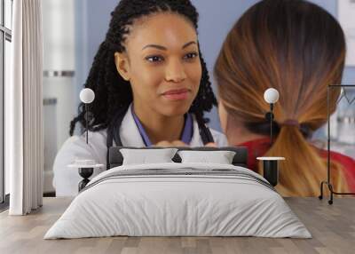 close up of african american physician with hand on shoulder of patient Wall mural