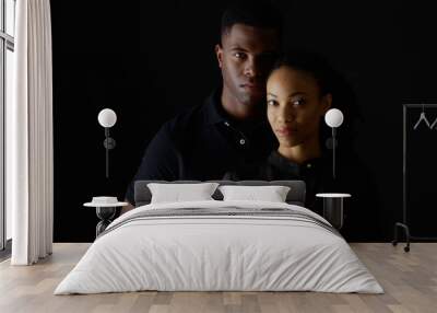 Dramatic portrait of strong young black couple Wall mural