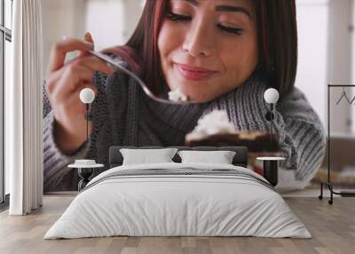 japanese woman eating cake at home Wall mural