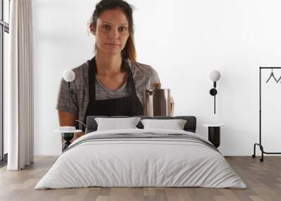 Serious waitress carrying tray with coffee beverages on white background Wall mural