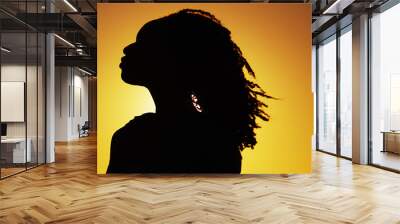 silhouette of african woman standing at sunset Wall mural