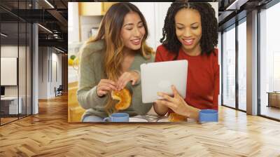 Two women best friends eating breakfast and using tablet computer Wall mural