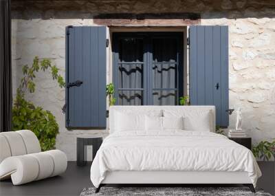 Open wooden window shutters on a french farm house Wall mural