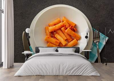 Penne Amatriciana fresh pasta with parmesan cheese on dark backg Wall mural