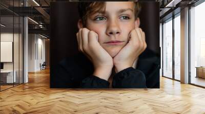 Portrait of blonde teenage boy on dark background outdoor. Low key close up shot of a young teen boy, adolescence. Selective focus. Loneliness, sadness, adolescent anxiety, emotional Wall mural