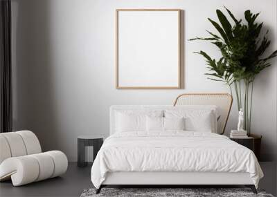 Blank picture frame mockup on white wall. White living room design. View of modern Boho style interior with chair. Home staging and minimalism concept Wall mural