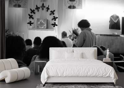 people praying in a church, one person reading the Bible Wall mural