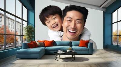 Portrait of a happy asian father and son isolated on white background. Ai generated. Wall mural