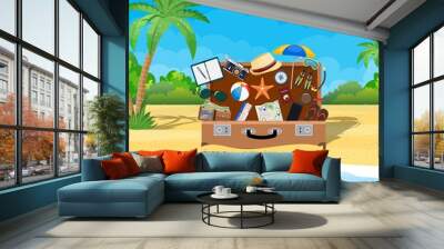 Open baggage, luggage, suitcases with travel icons and objects on tropical background. vector illustration in flat design Wall mural