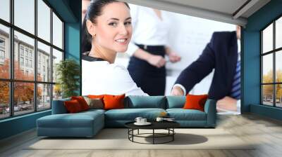 Business handshake at meeting or negotiation in the office. Two businesspeople partners are satisfied because signing contract or financial papers Wall mural