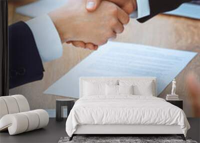 Business people shaking hands at meeting or negotiation in the office. Handshake concept. Partners are satisfied because signing contract Wall mural