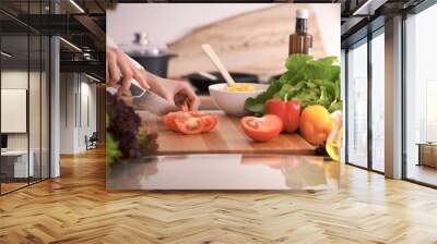 Close Up of human hands cooking vegetable salad in kitchen on the glass table with reflection. Healthy meal, and vegetarian food concept Wall mural