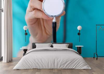 female doctor holds stethoscope head closeup. physicians ready to examine and help patient. medical  Wall mural