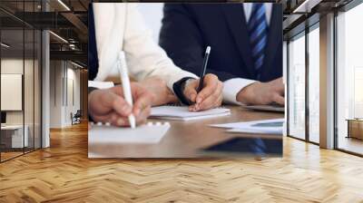 Group of business people or lawyers  at meeting, hands close-up Wall mural