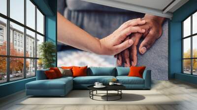 two hands man and woman showing act of support togetherness or kindness Wall mural