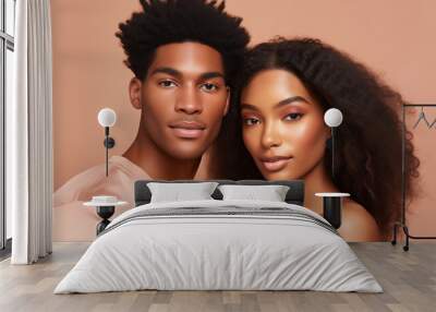 Beauty portrait of pretty young African couple, beautiful black woman and man on studio background Wall mural