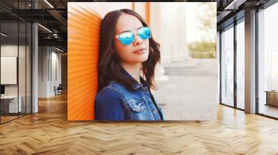 Fashion portrait of beautiful young woman in the sunglasses Wall mural