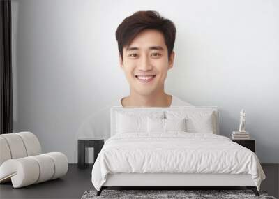 Portrait of handsome happy smiling asian young man, modern guy looking at camera on white background Wall mural