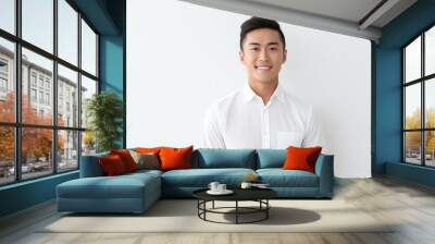 Portrait of handsome happy smiling asian young man, modern guy looking at camera on white background Wall mural