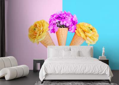 Three ice cream cone with colorful flowers over pink blue backgr Wall mural