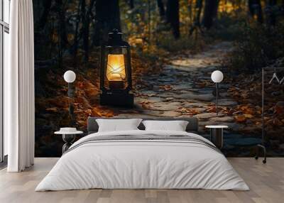 A mysterious lantern flickers on a stone pathway leading  a dark forest casting shadows on the fallen leaves Wall mural