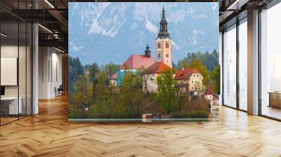 Beautiful cozy Lake Bled and the church on the island in the background with castle in the morning lights in the Julian Alps Wall mural