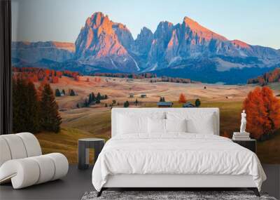 Mountain meadow and wood house Alpe di Siusi or Seiser Alm in the background Langkofel mountain range at beautiful sunset with Province of Bolzano, South Tyrol in Dolomites Wall mural