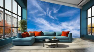 emerald blue sky with a pattern of white clouds in them Wall mural