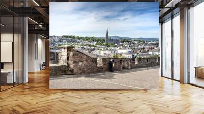 Londonderry, Northern Ireland: Skyline of Derry with St. Eugene's Cathedral near Free Derry Corner, city wall. horizon and blue sky Wall mural