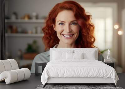 Portrait of smiling mature woman looking at camera with big grin. Successful middle aged woman at home smiling. Beautiful mid adult lady with long red hair enjoying whitening teeth treatment Wall mural