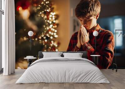 Boy Praying by Christmas Tree Wall mural