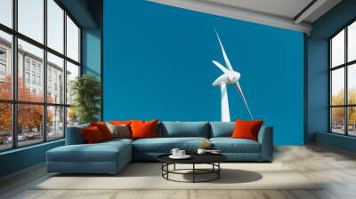 A wind turbine against the blue sky Wall mural