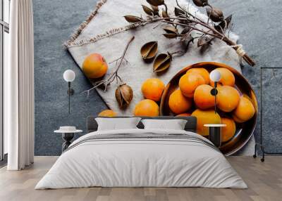 Apricots in a metal pial are stacked Wall mural