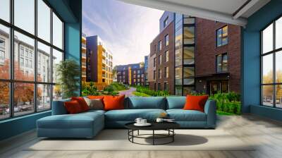 Apartment in residential building exterior. Housing structure at blue modern house of Europe. Rental home in city district on summer. Wall and glass high architecture for business property investment. Wall mural