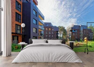 Benches at Modern european complex of apartment buildings Wall mural